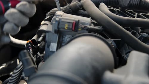 Close Up Shot of Auto Mechanic Repair Engine at Car Repair Shop Slow Motion