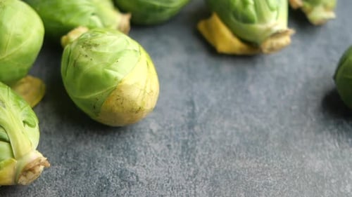 Fresh Brussels Sprouts on a Gray Surface Ready for Cooking