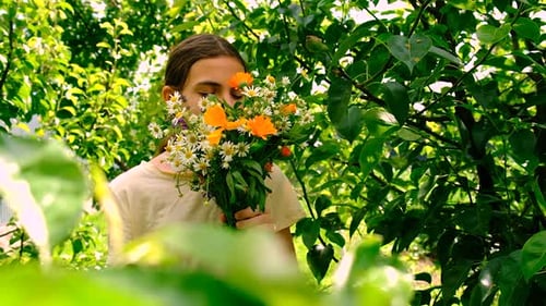 Teen Smelling Flowers then Holding Medicine
