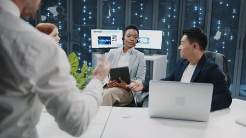 Group of People on Business Meeting in Data Center Multiethnic Experienced Staff of IT Workers