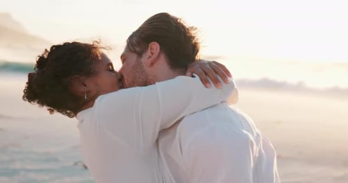 Kiss, travel and couple on holiday, beach and romance for valentines day on trip