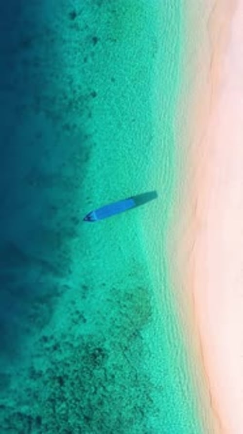 Aerial View of Turquoise Water and White Sand Beach