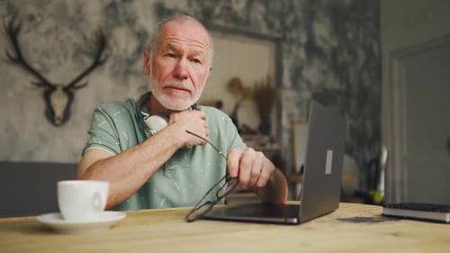 Stressed Old Man in Glasses