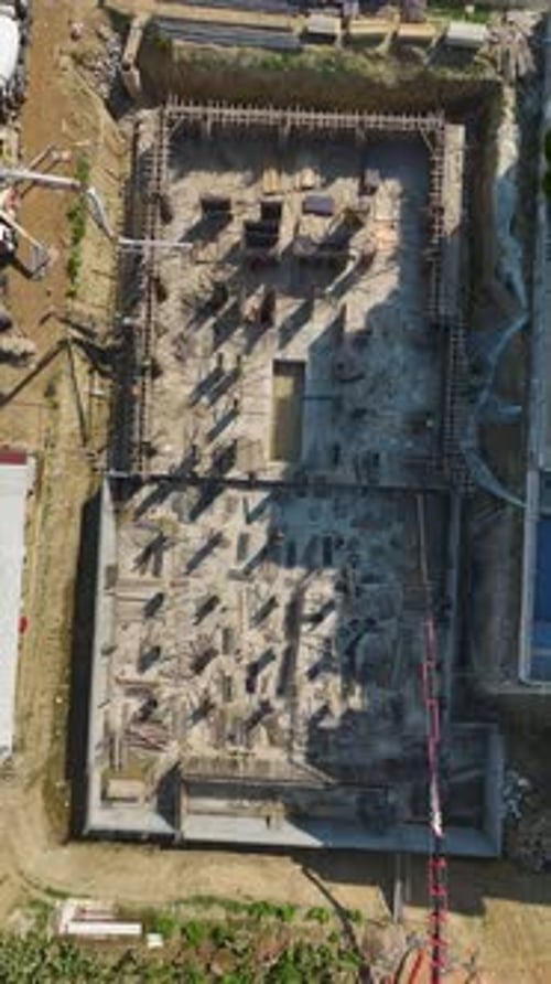 Vertical Video Engineers Lead Rebar Shaping and Concrete Pouring on a HighQuality Construction Site