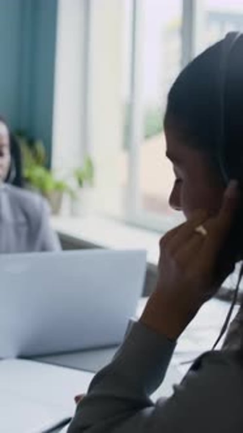 Diverse Female Operators Consulting Online Clients about Service Quality