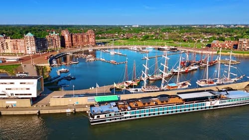 Diverse water transport at the berths in the port. Sunny marina of Lelystad, the Netherlands.
