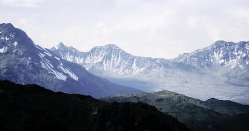 Majestic Mountain Range Bathed in Soft Light Showcases Natures Beauty