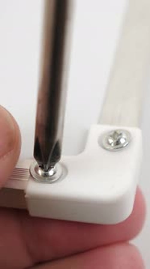 Removing Screw with Screwdriver Tool Close Up