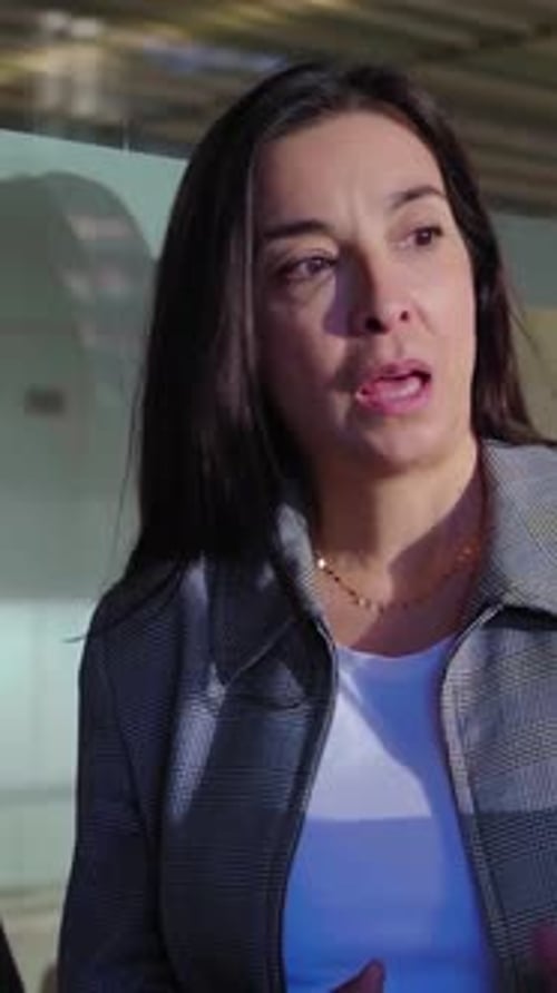Three Mature Businesswomen Talking at the Office About Work Projects for the Financial Industry