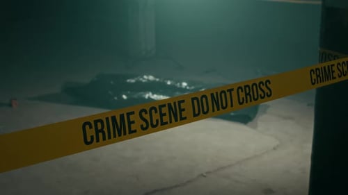 Crime Scene Tape Blocks View of Covered Body
