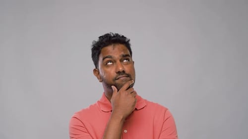 Man Thinking with Hand on Chin in Studio