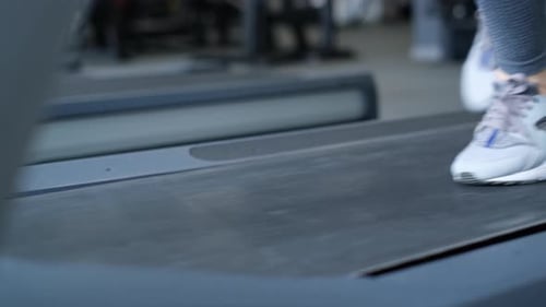 Closeup of a Woman Working Out on a Treadmill in a Gym Active Lifestyle Sport Concept