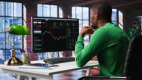 Professional Works at Urban Office Desk With Computer