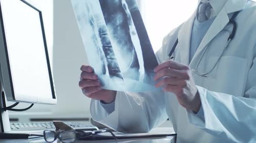 Professional Medical Doctor Working in Hospital Office Using Computer Technology Medicine and