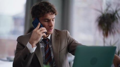 Dissatisfied Ceo Cellphone Call Discussing Report Office with Documents Closeup