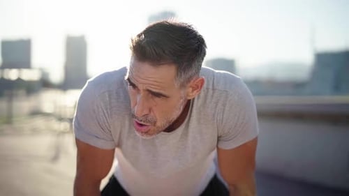 Man Resting After Workout in City
