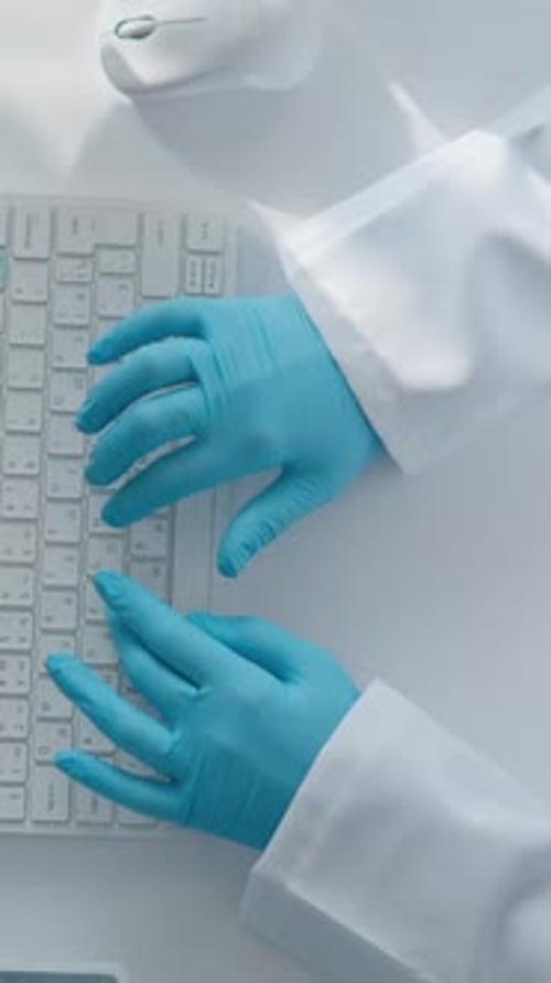 A Dedicated Researcher is Meticulously Analyzing Complex Data Within a Controlled Laboratory