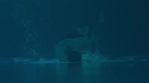 Swimmer in Blue Water