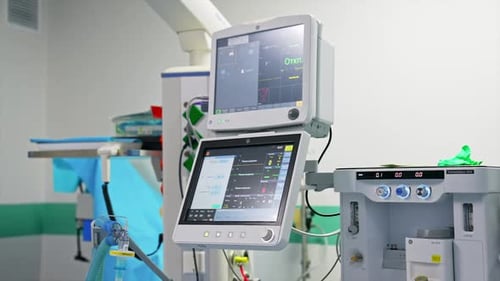 Working screens in the modern surgery room. Close up with gradual distancing.