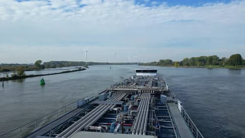 Flying Over Tanker Ship Navigating On A River In Barendrecht, Netherlands. aerial