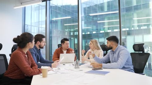 Group of business people communicate at conference meeting in office boardroom. Corporate team