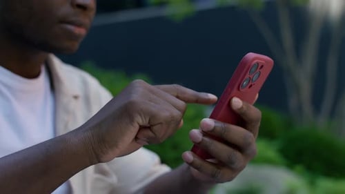 Young Adult Using Smartphone Outdoors