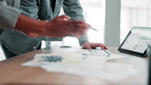 Business People Reviewing Finances at Desk