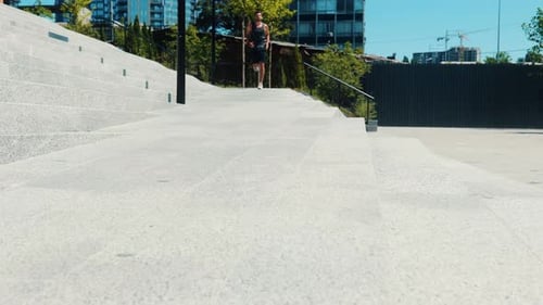 Man Running Toward Camera on Concrete Path