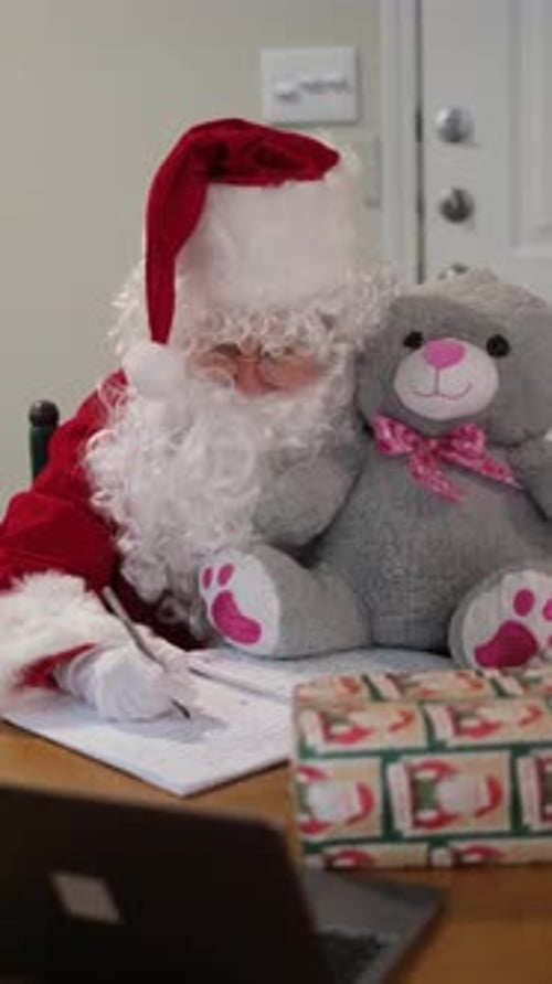 Santa Claus Writing His Naughty or Nice List