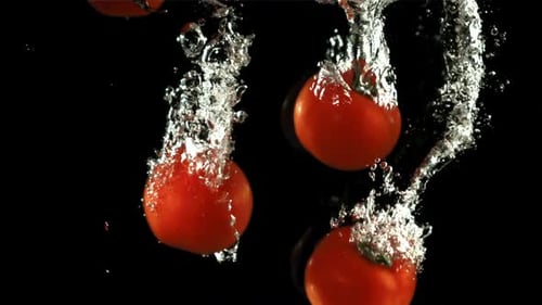 Tomatoes Fall Under Water Filmed is Slow Motion 1000 Fps