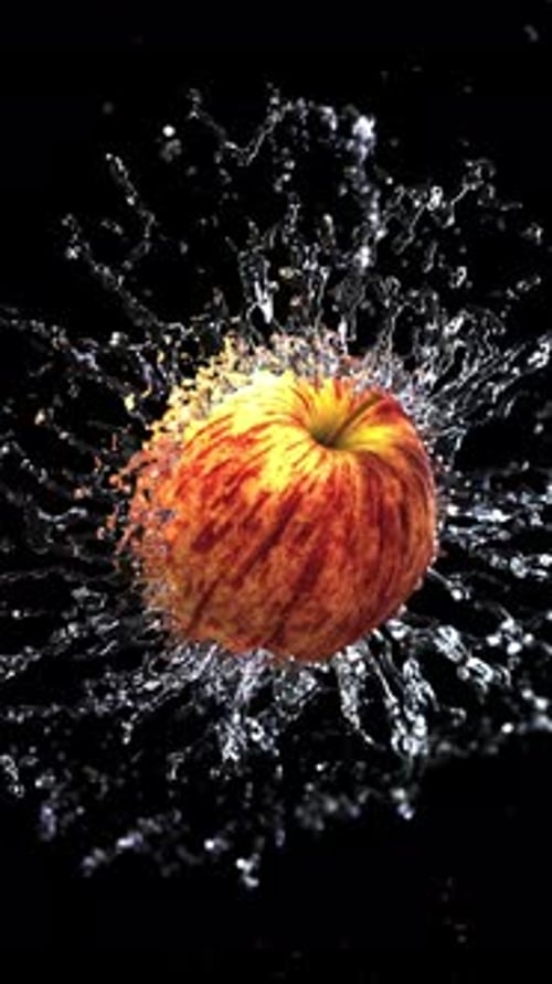 Dynamic Red Apple Splashing Water Animation