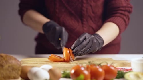 Slicing Fresh Ripe Tomato on Wooden Cutting Board – Close-Up of Hands Preparing Ingredients for Cook