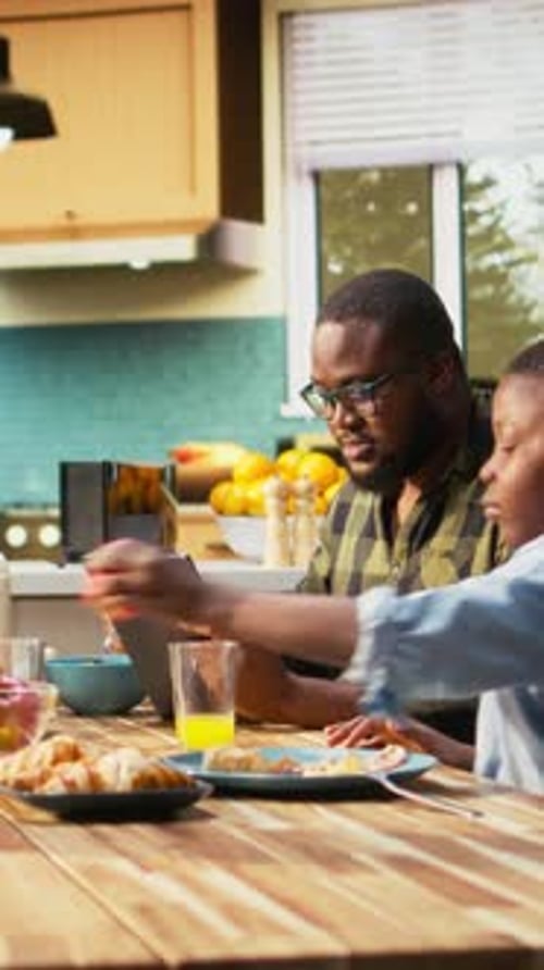 Vertical Video Black Distracted Father Paying Attention to Work on Tablet and Ignoring Family