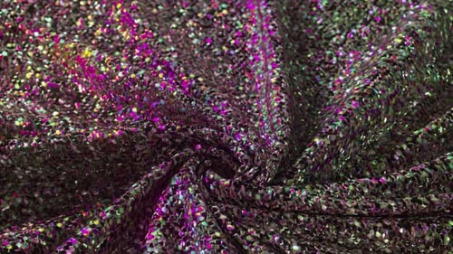 Un tourbillon de paillettes éblouissantes scintille de couleurs vives, créant ainsi un visuel envoûtant pour la 3D