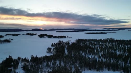 Aerial view of winter landscapes with snow-covered forest in Finland