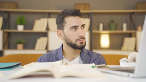 Unhappy and thoughtful college student.