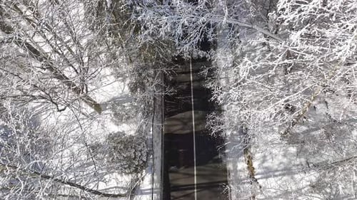 Car passing on the winter mountain road. Beautiful winter landscape with mountain road