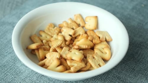 Letter Shaped Crackers in a White Bowl