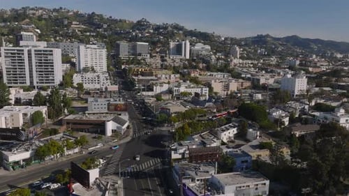 Forwards Fly Above Town Development in Urban Borough Vehicles Driving in Streets Los Angeles
