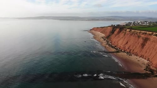 Aerial Along Exmouth Jurassic Coastline With Beside Waters Of English Channel. Dolly Forward