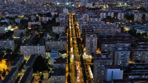 Aerial view of Barcelona city at night, Streets with busy car traffic and city lights, Nou Barris