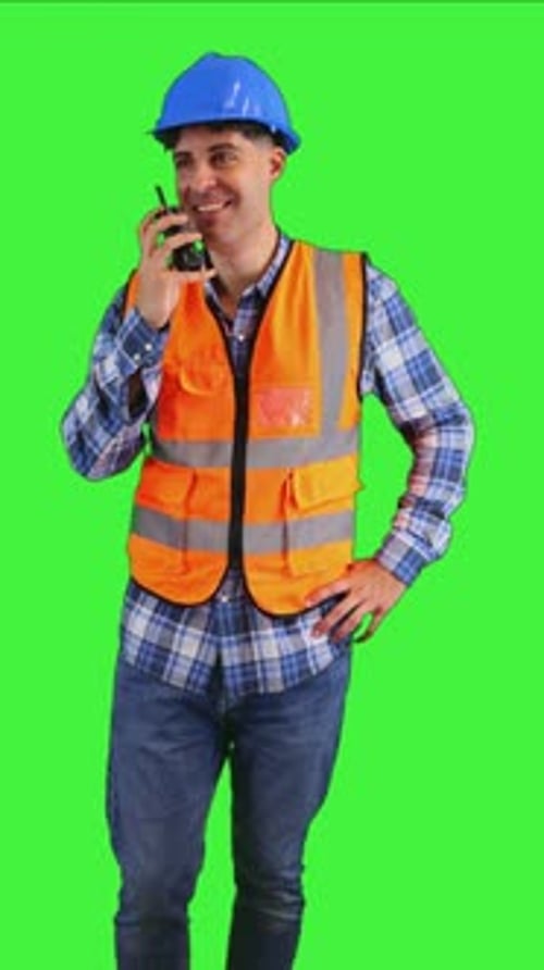 vertical Construction worker communicating through his walkie-talkie chroma key