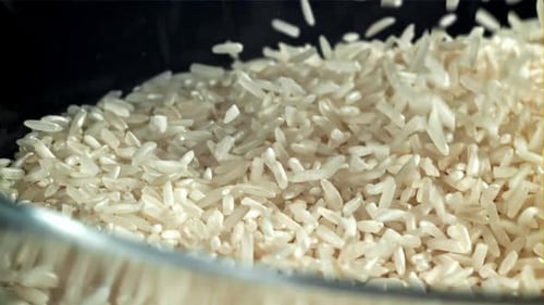 The Grains of Rice Fall Into the Pot Filmed on a Highspeed Camera at 1000 Fps