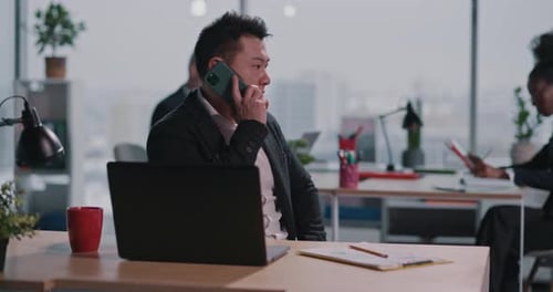 Professional man on phone working in office