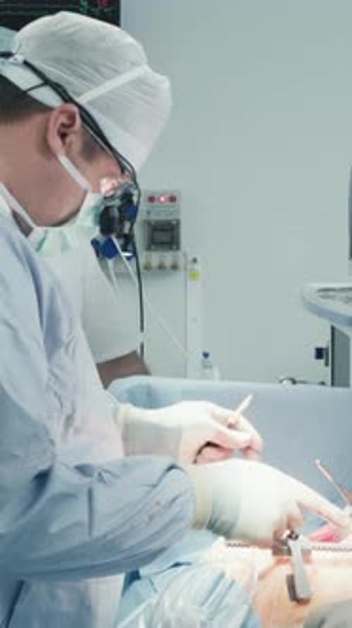 Surgeons Performing Operation in Hospital Operating Room