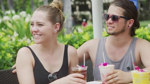 Couple in Hawaii Having Cocktails Alcohol