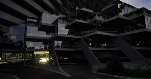 Estructura arquitectónica única con diseño moderno en un entorno urbano al anochecer