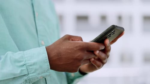 Black man, hands and typing on phone outdoor for communication with 5g network connection in city