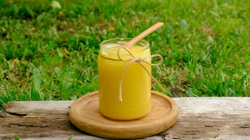 Ghee in a Jar in a Meadow Selective Focus