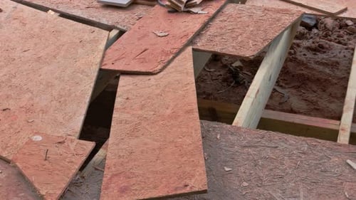 Floorboards are Damaged and Uneven at a Construction Site During Renovation Process